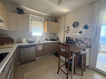 Sea And Sunset View Reverse Duplex In Bodrum For Sale - Kitchen with balcony access