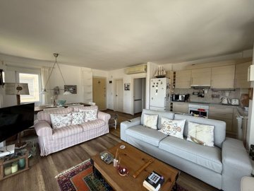 A Sea & Nature View Apartment In Bodrum For Sale - Lounge and kitchen
