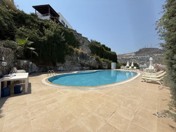 A Sea & Nature View Apartment In Bodrum For Sale - Large communal sun terraces around the pool