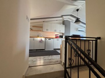 Duplex Apartment For Sale In Hisar, Didim - Looking up to the open-plan living area