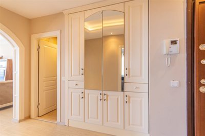 Immaculate Seafront Apartment in Mahmutlar, Alanya For Sale - Fitted cupboards in the hallway