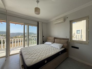 Luxurious Renovated Villa For Sale In Milas, Bogazici - First bedroom with a balcony