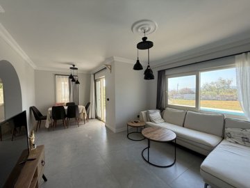 Luxurious Renovated Villa For Sale In Milas, Bogazici - Living room through to the dining area