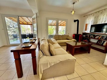 Dramatic Fethiye Villa For Sale In Ovacik With A Private Pool - Lounge with a fireplace