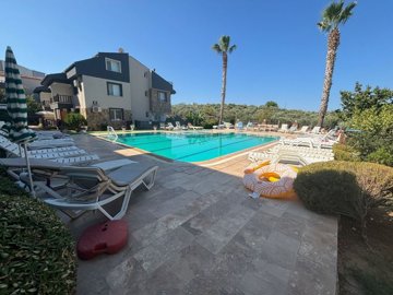 Furnished Didim Apartment On A Complex For Sale In Hisar - Communal pool and sunbathing terraces