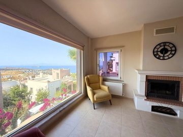 Sea View Bodrum Villa For Sale In Koyunbaba, Gumusluk - Lounge with a fireplace
