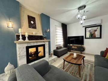 Semi-Detached Villa For Sale In Dalyan With A Shared Pool - Lounge with fireplace