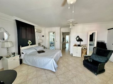 Sea View Fethiye Apartment For Sale Near The Promenade - Bedroom with an ensuite bathroom