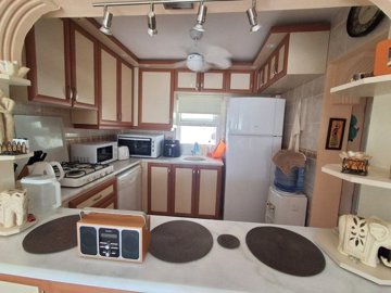 Semi-Detached Villa For Sale In Akbuk, Didim – Looking into the kitchen from the lounge