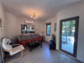 A Traditional Garden Apartment With Modern Accents Is For Sale In Dalyan - Lounge out to the garden