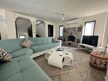 Charming Villa For Sale In Dalyan With A Private Pool & Garden - Spacious lounge with a fireplace