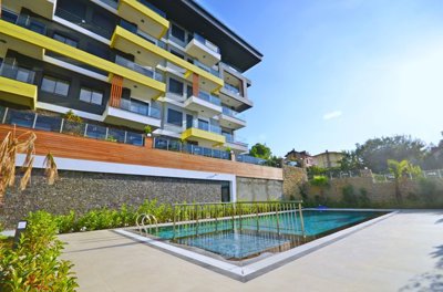 Sophisticated Alanya Investment Property For Sale - Modern building with shared pool & terraces