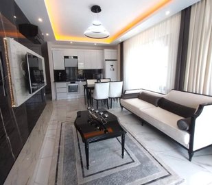Exceptional Two-Storey Furnished Apartment In Alanya For Sale In Avsallar - Open-plan lounge and kitchen