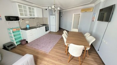 Notable Alanya Property For Sale in Mahmutlar - Lounge to kitchen