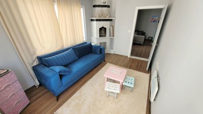 Notable Alanya Property For Sale in Mahmutlar - First bedroom set up as a lounge area