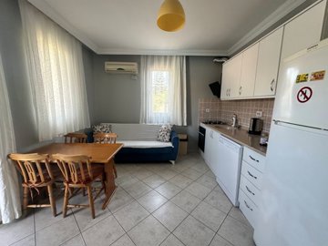 Fully Furnished Apartment For Sale In Dalyan, Mugla - Open-plan living room