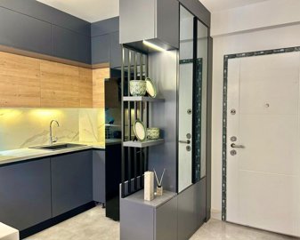 Stylish Apartments In Kusadasi For Sale With On-Site Facilities - Entrance and kitchen