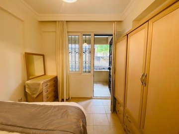 Garden Apartment In A Great Location For Sale In Altinkum – Bedroom with balcony to the garden