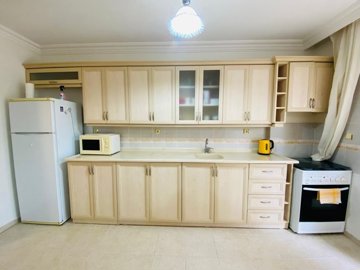 Garden Apartment In A Great Location For Sale In Altinkum – Kitchen with white goods