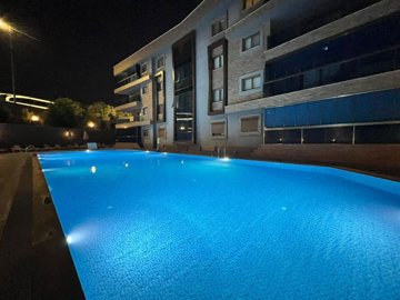 Immaculate Apartment In Kusadasi For Sale With A Shared Pool - Lit up communal pool