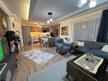 Immaculate Apartment In Kusadasi For Sale With A Shared Pool - Spacious open-plan living room