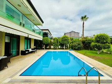 Sensational Investment Property For Sale In Alanya - Pool surrounded by sunbathing areas