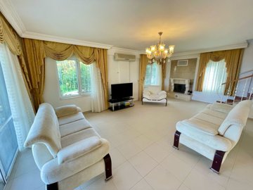 Sea & Castle View Investment Property For Sale In Kargicak, Alanya - Spacious living area with fireplace