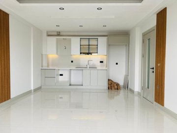 Versatile Apartments In Kusadasi For Sale With A Shared Pool - Open-plan living space