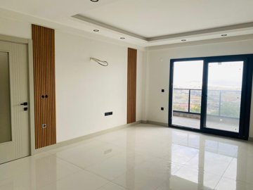 Versatile Apartments In Kusadasi For Sale With A Shared Pool - Lounge area with balcony access