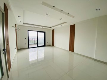 Versatile Apartments In Kusadasi For Sale With A Shared Pool - From the kitchen to lounge area