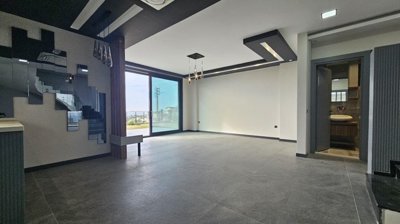 State Of The Art Villa In Kusadasi For Sale With Sea Views Near The Beach - Kitchen to lounge and bathroom