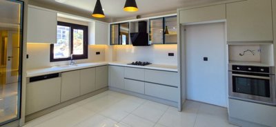 Newly Built Apartments In Kusadasi With A Shared Pool For Sale - An array of storage cabinets