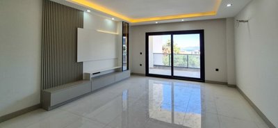 Newly Built Apartments In Kusadasi With A Shared Pool For Sale - Lounge with balcony