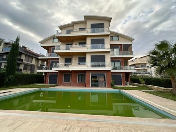 Key-Ready Ground-Floor Apartment In Belek For Sale - Apartment building with communal pool