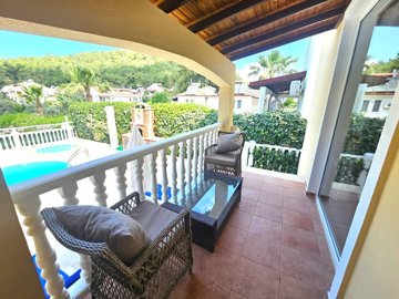 An Impressive Villa For Sale In Fethiye - Covered terrace with pool views