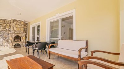 Stone Bungalow For Sale In Dalaman With A Private Pool & Garden - Covered terrace from the living space with BBQ