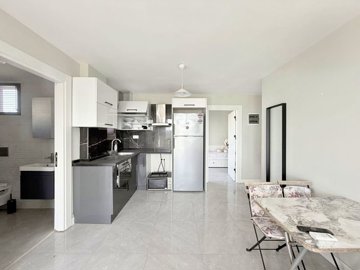 Blissful Apartment For Sale In Dörttepe, Milas - Dining area and kitchen