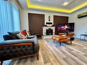 Sensational Fethiye Property For Sale - Lounge with a feature fireplace