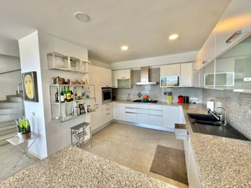 Sea-View Property For Sale In Fethiye - Kitchen equipped with white goods and appliances