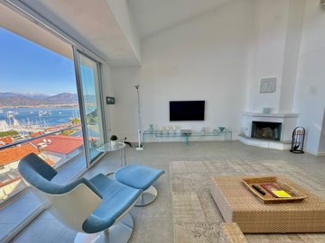 Sea-View Property For Sale In Fethiye - Lounge with a fireplace
