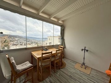 Sea & City View Property For Sale In Bodrum - Covered & enclosed balcony with stunning vistas