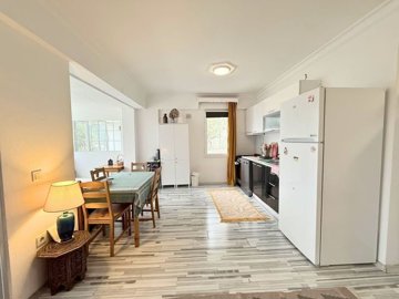 Sea & City View Property For Sale In Bodrum - Looking into the kitchen and lounge