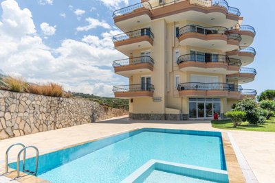 Blissful 2-Bedroom Apartment For Sale In Alanya, Mahmutlar – Communal pool
