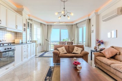 Blissful 2-Bedroom Apartment For Sale In Alanya, Mahmutlar – Open-plan living room