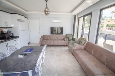 Deluxe Apartment For Sale In Ovacik, Fethiye – Dining area and lounge