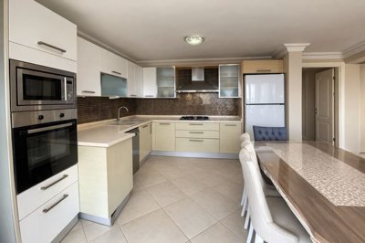 Sea-View Apartment For Sale In Kusadasi - Large kitchen with appliances