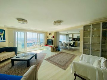 Sea-View Apartment For Sale In Kusadasi - Lounge through to the kitchen