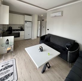 Modern One-Bedroom Apartment For Sale In Antalya - Open-plan living room