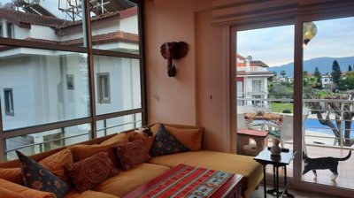 Sleek Property For Sale Near The Beach In Fethiye - Lounge out to the balcony