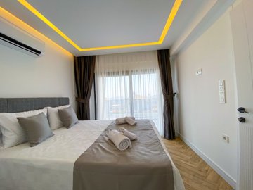 Sea View Luxury Property For Sale In Fethiye - Double bedroom with ensuite and shared balcony